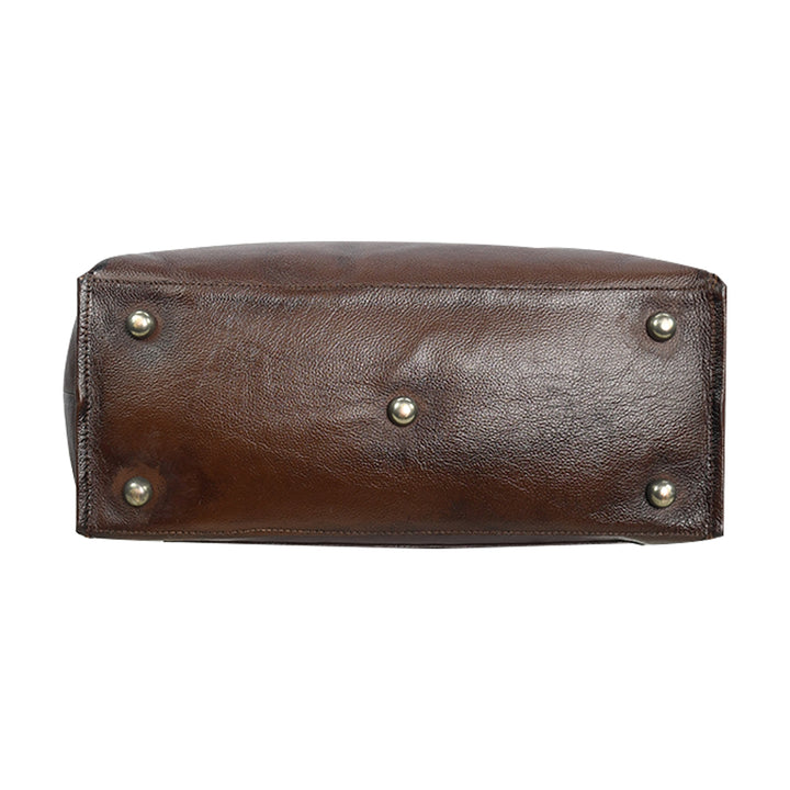 Brown leather clutch with gold studs on a white background