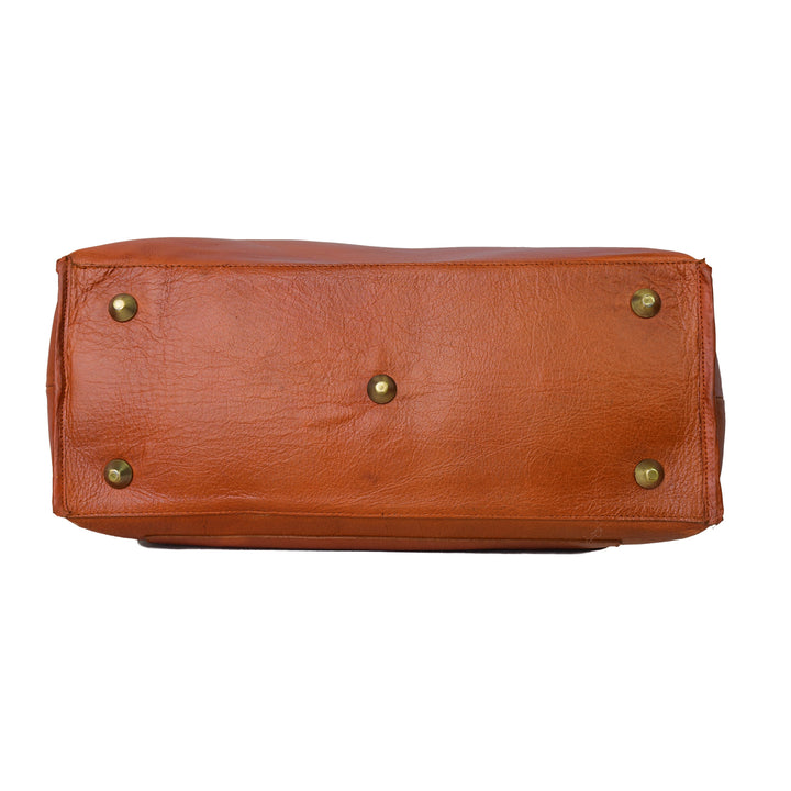 Brown leather handbag with gold studs on a white background