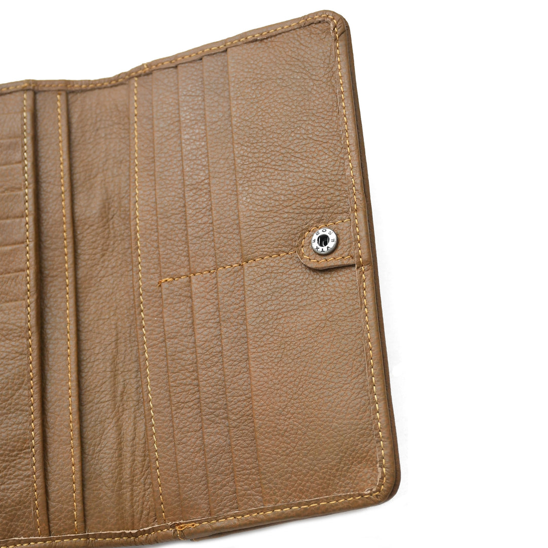 Close-up of a brown leather wallet with stitching details on a white background