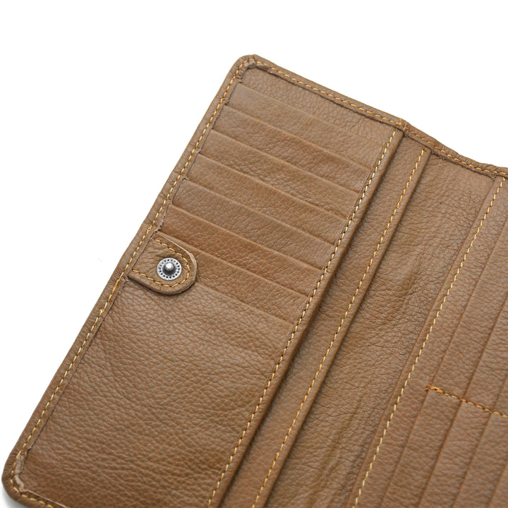 Close-up of a brown leather wallet with stitching details on a white background