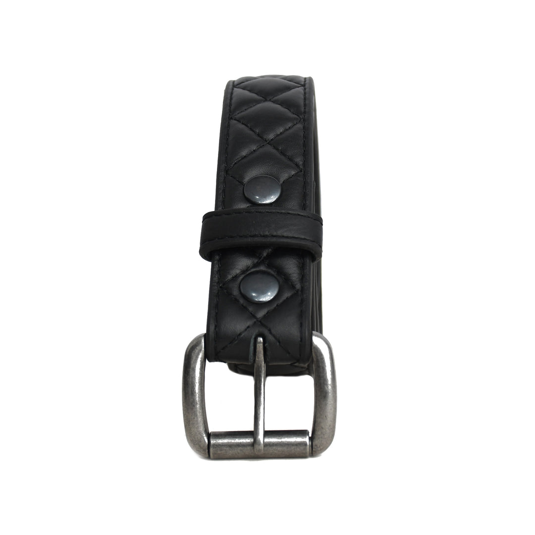 Black quilted leather belt with silver buckle on a white background