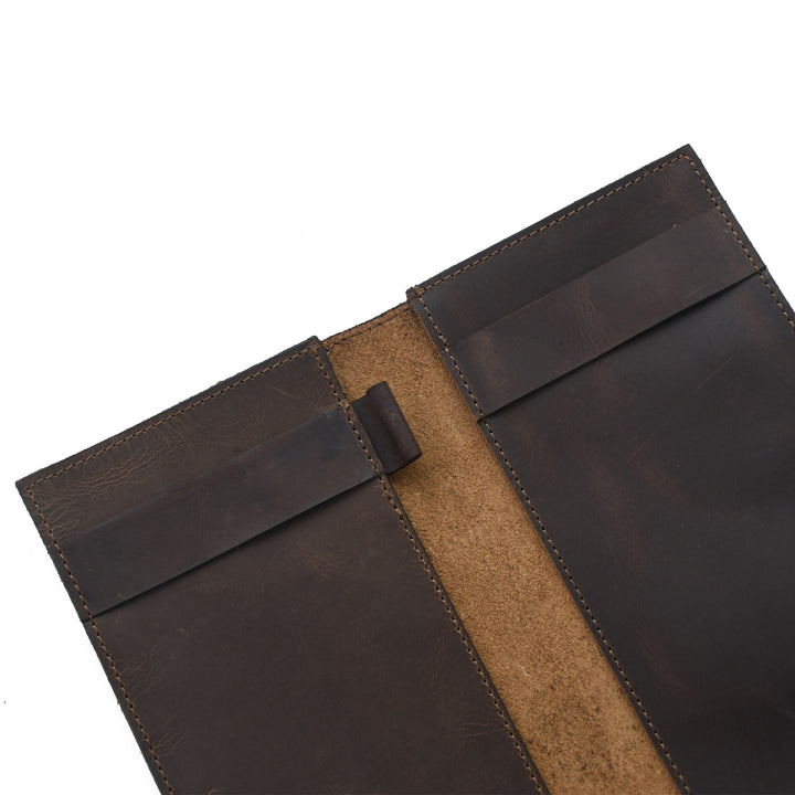 Brown leather wallet with a strap on a white background