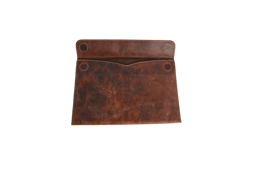 Brown leather Laptop Sleeves grommets on a white background