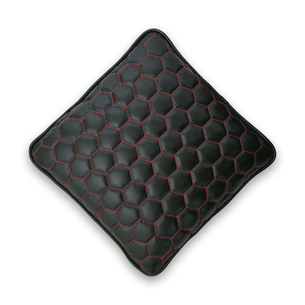 Black hexagonal patterned cushion on a white background