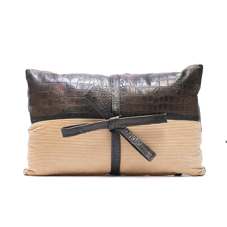 Two decorative pillows with crocodile texture on a white background