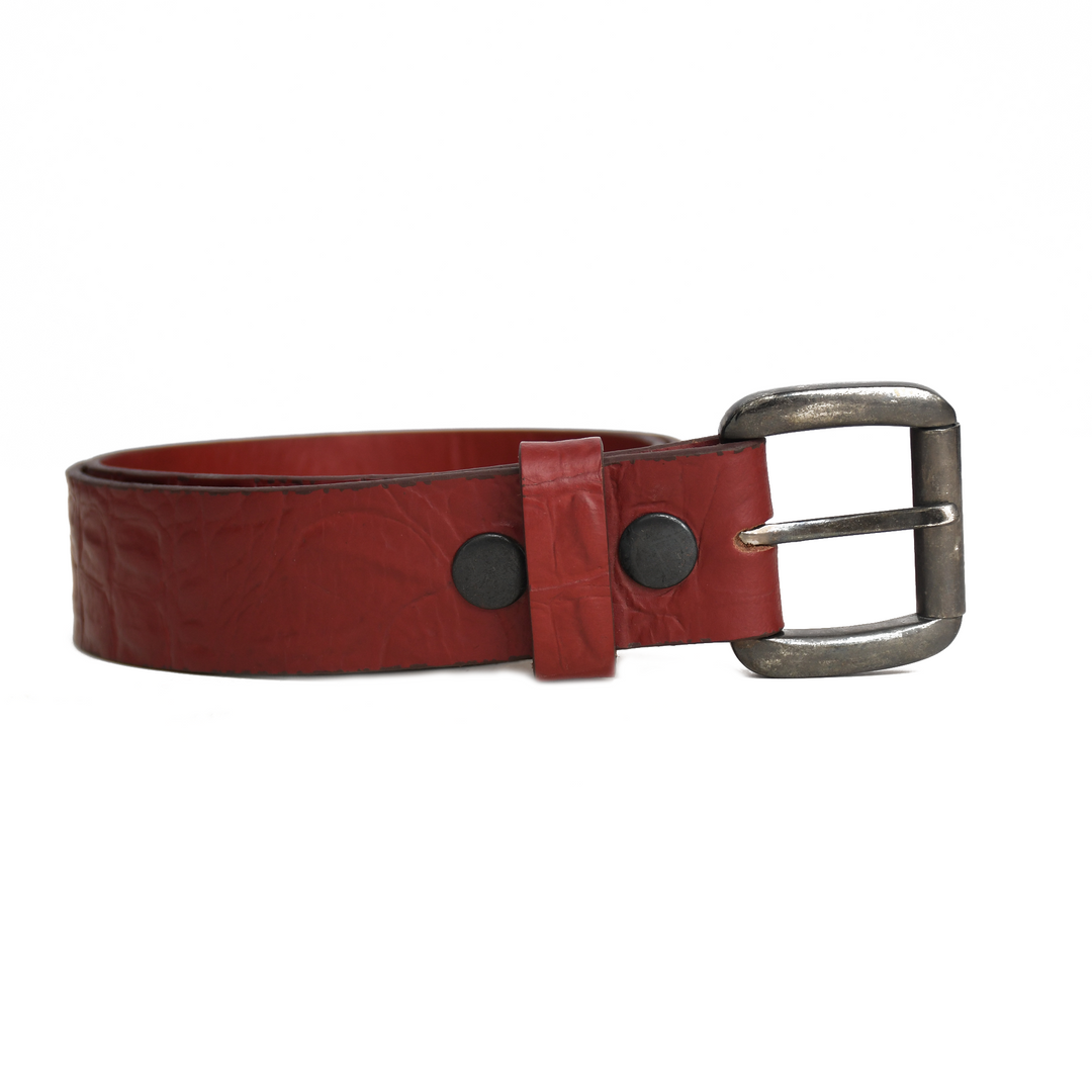 Red leather belt with a silver buckle on a white background