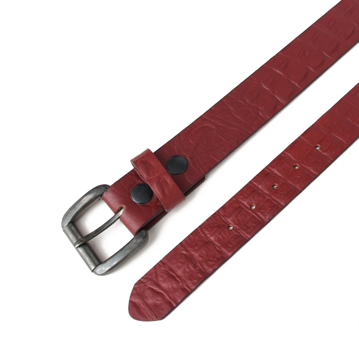 Red leather belt with a silver buckle on a white background