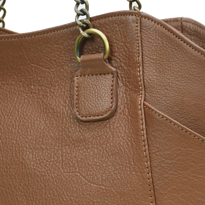 Close-up of a brown leather handbag with a chain shoulder strap.