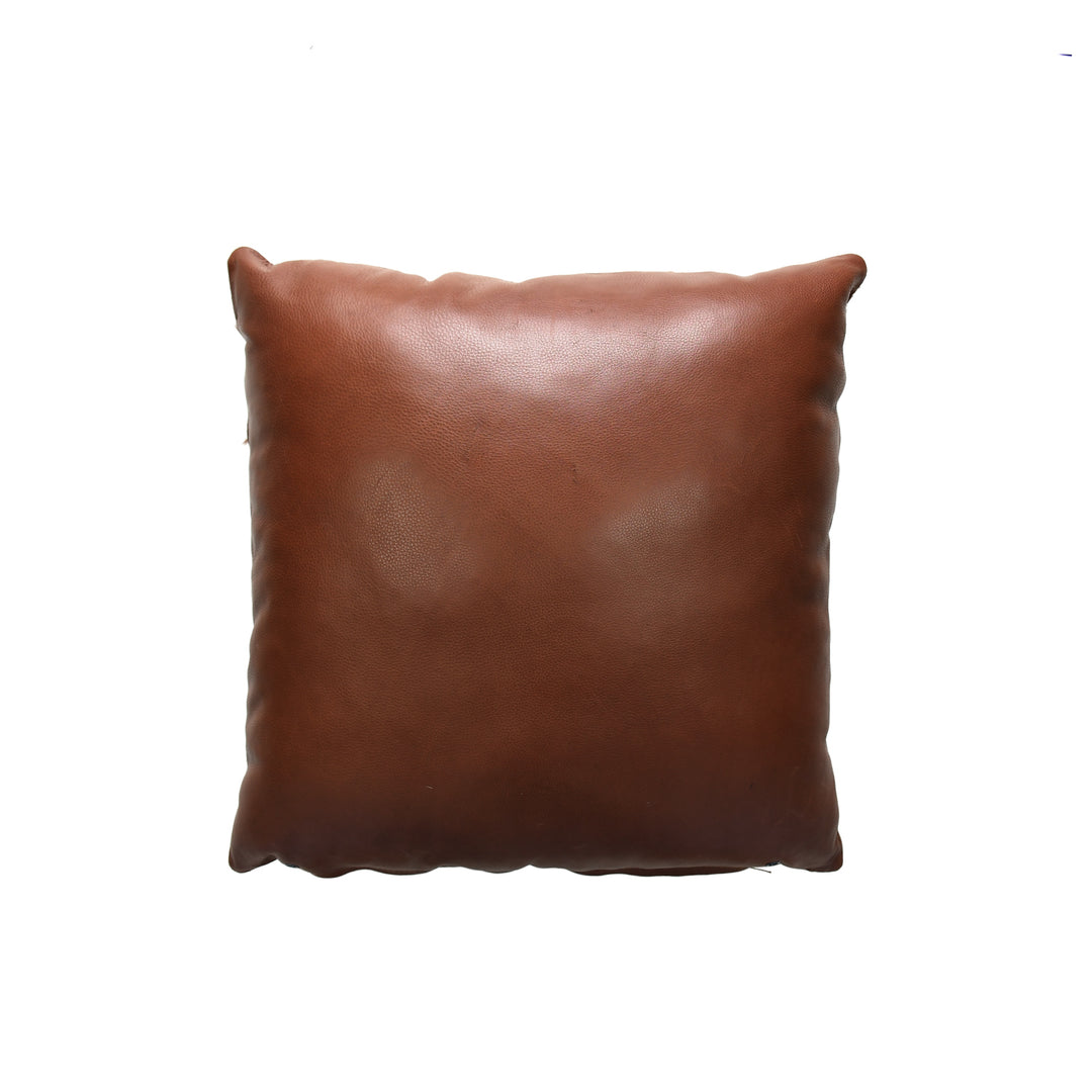 Brown leather pillow on a white background