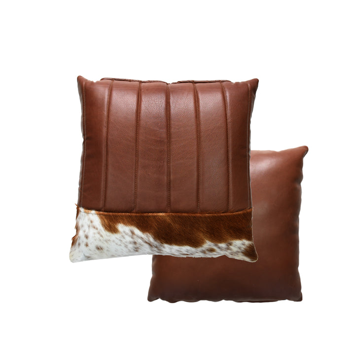 Brown leather pillow with cowhide pattern on a white background