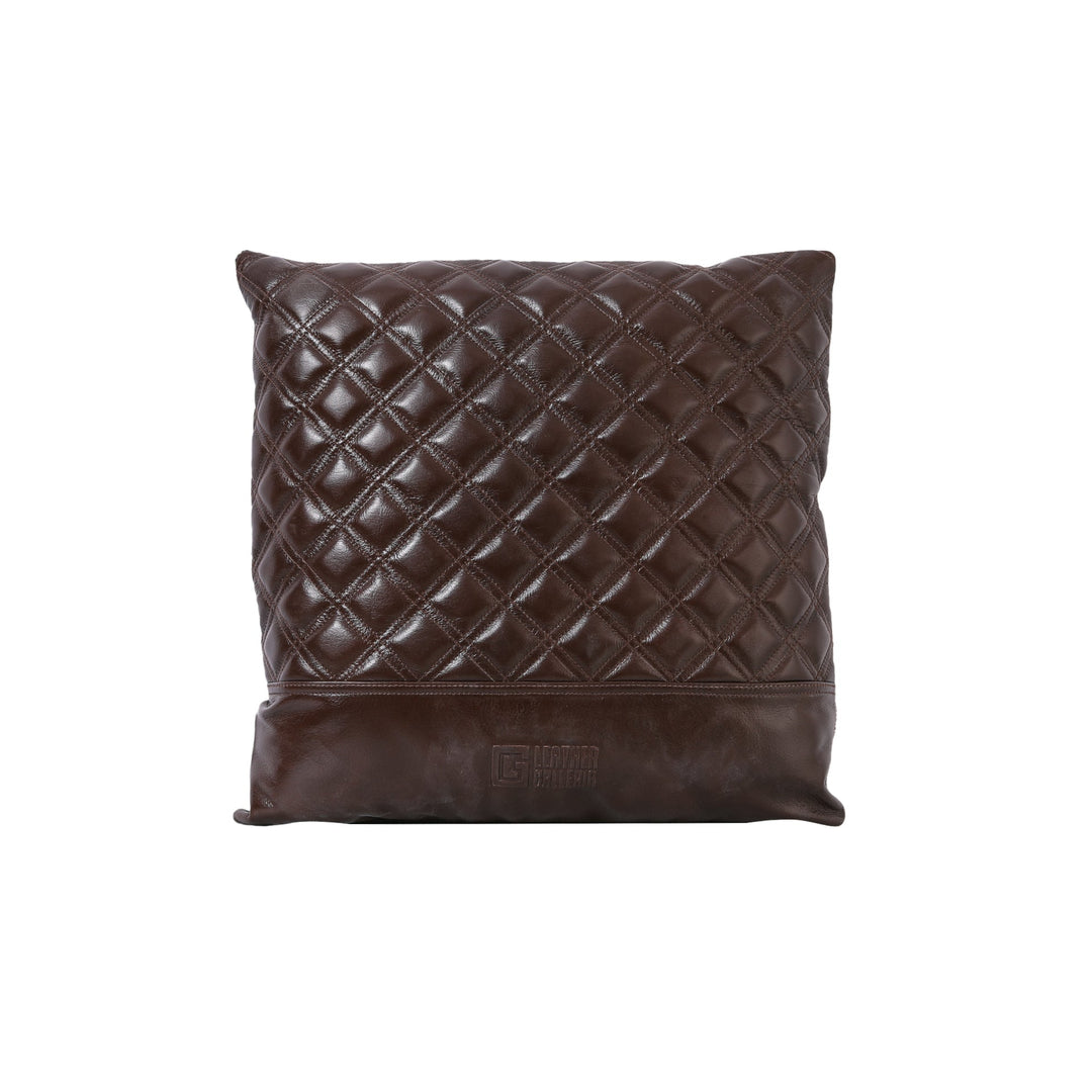 Brown quilted pillow on a white background