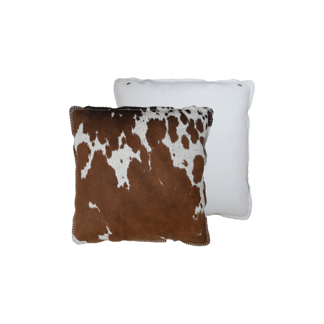 Two pillows, one with a brown and white cowhide pattern and the other plain white, on a white background.