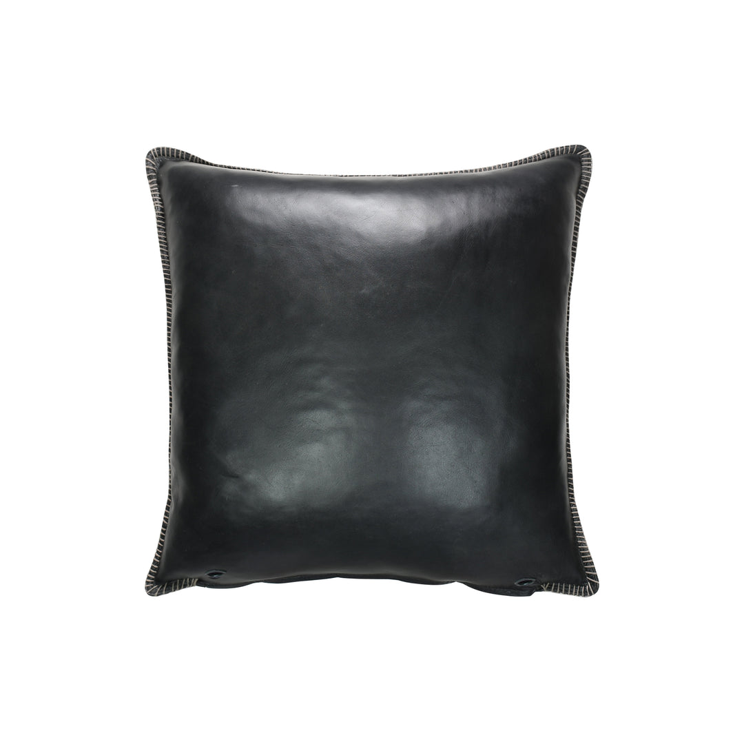 Black leather pillow on a white background