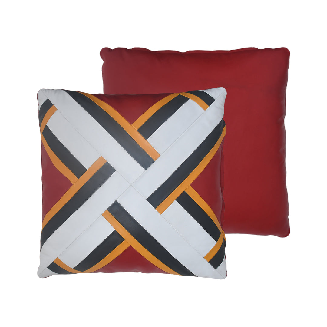 Two pillows, one with a geometric pattern and the other solid red, on a white background.