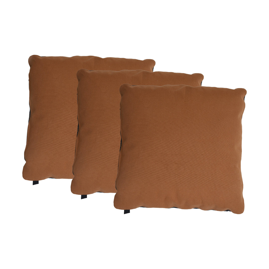 Three brown textured pillows on a white background