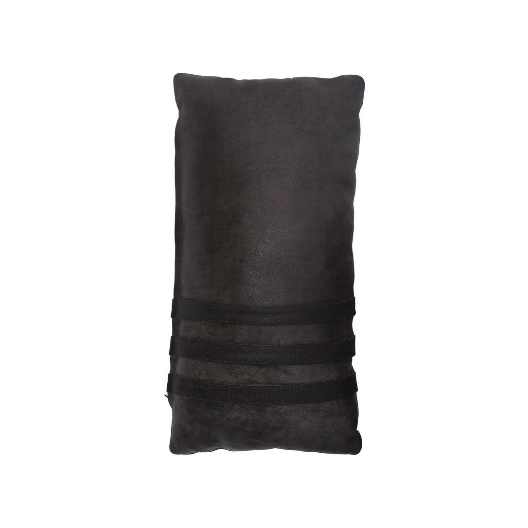 Black pillow with a textured surface on a white background