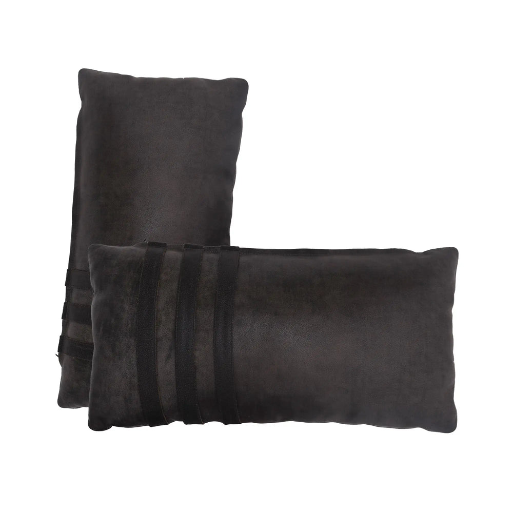 Two dark gray pillows on a white background