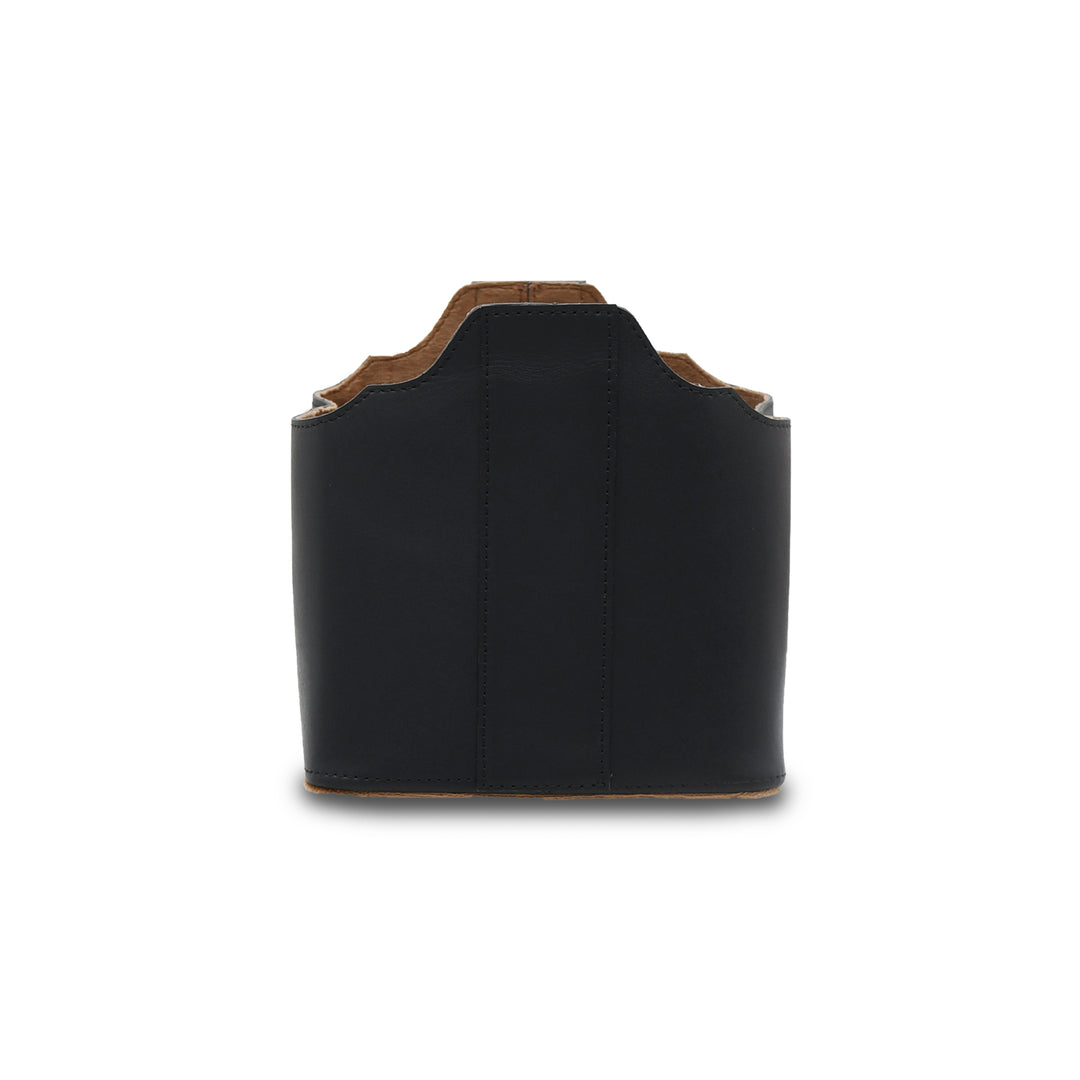 Black leather holster with brown trim on a white background