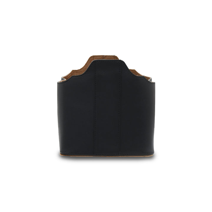 Black leather holster with brown trim on a white background