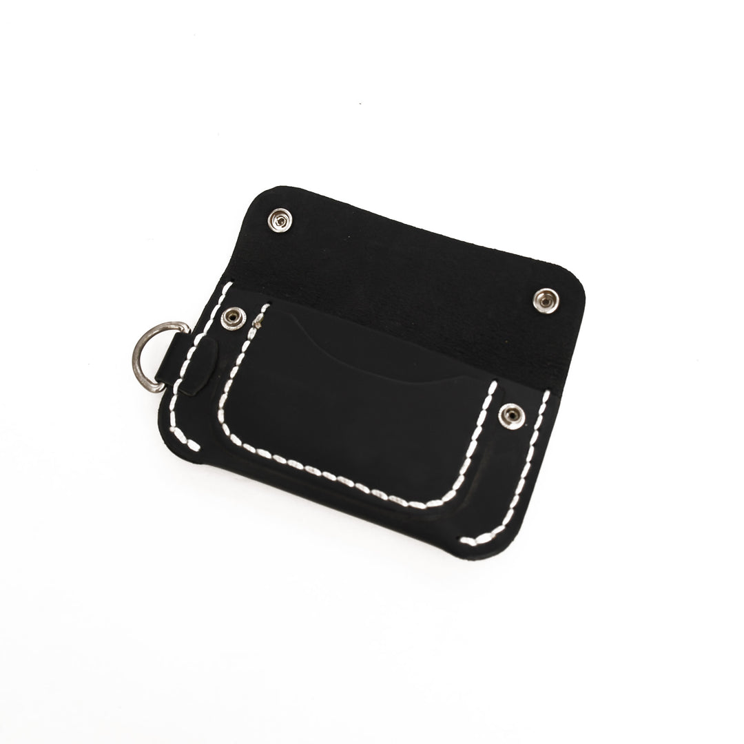 Black leather pouch with white stitching on a white background