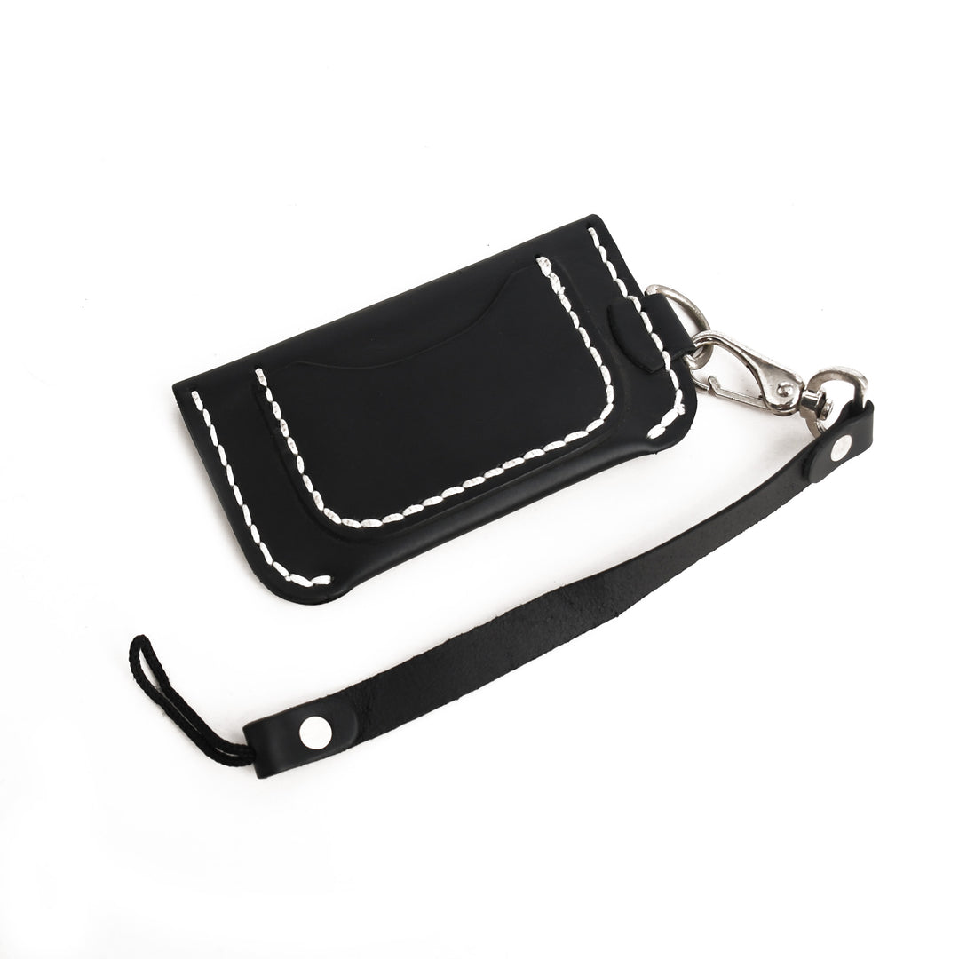 Black leather wallet with white stitching on a white background