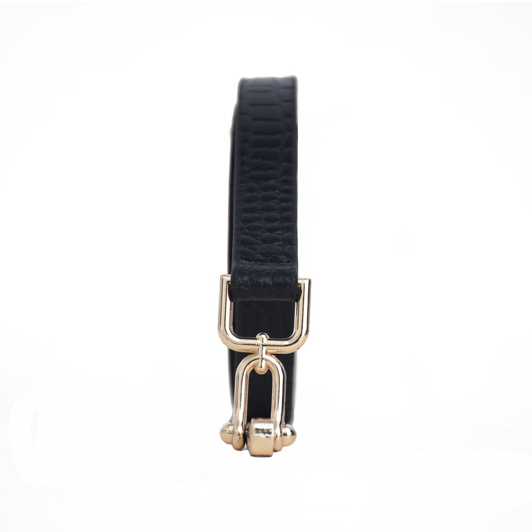 Black leather belt with gold buckle on a white background