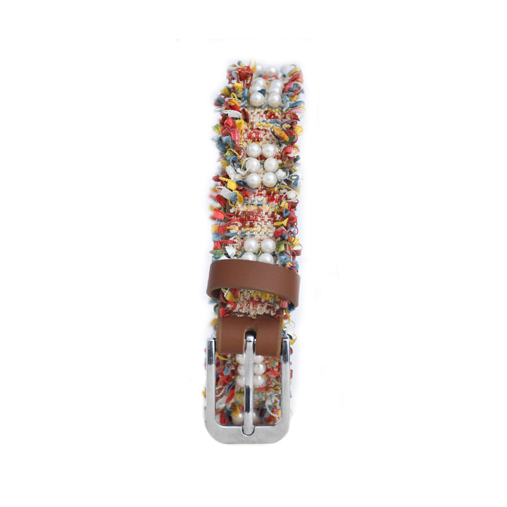 Multicolored beaded belt with a brown leather strap on a white background