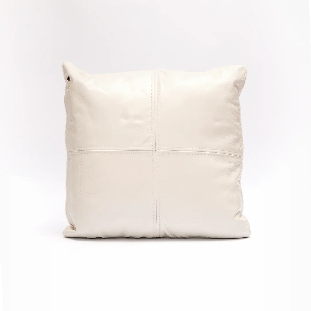 Beige leather pillow on a white background