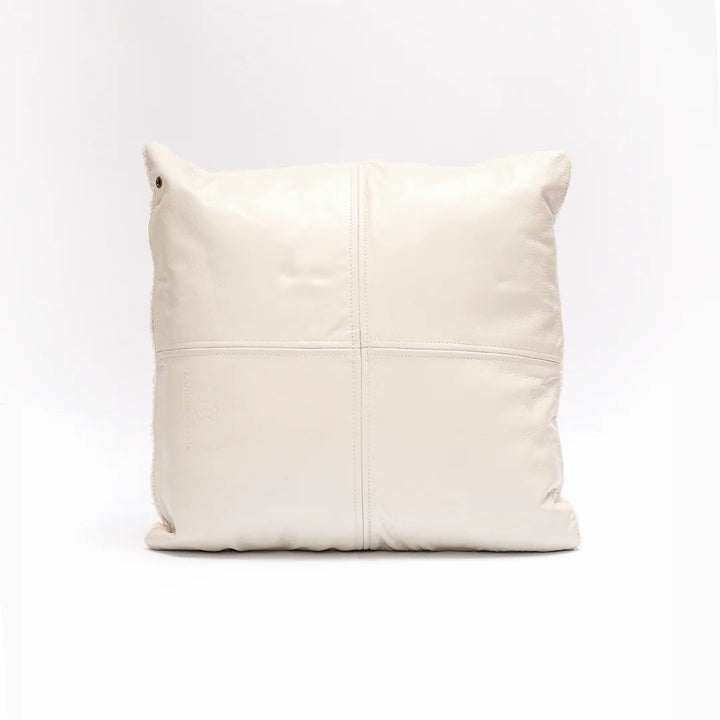 Beige leather pillow on a white background