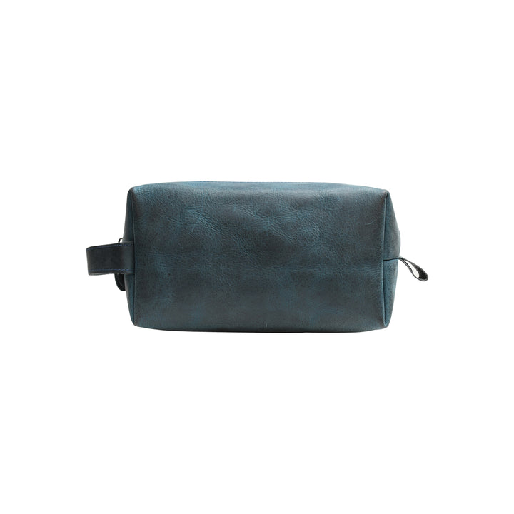 Blue leather toiletry bag on a white background