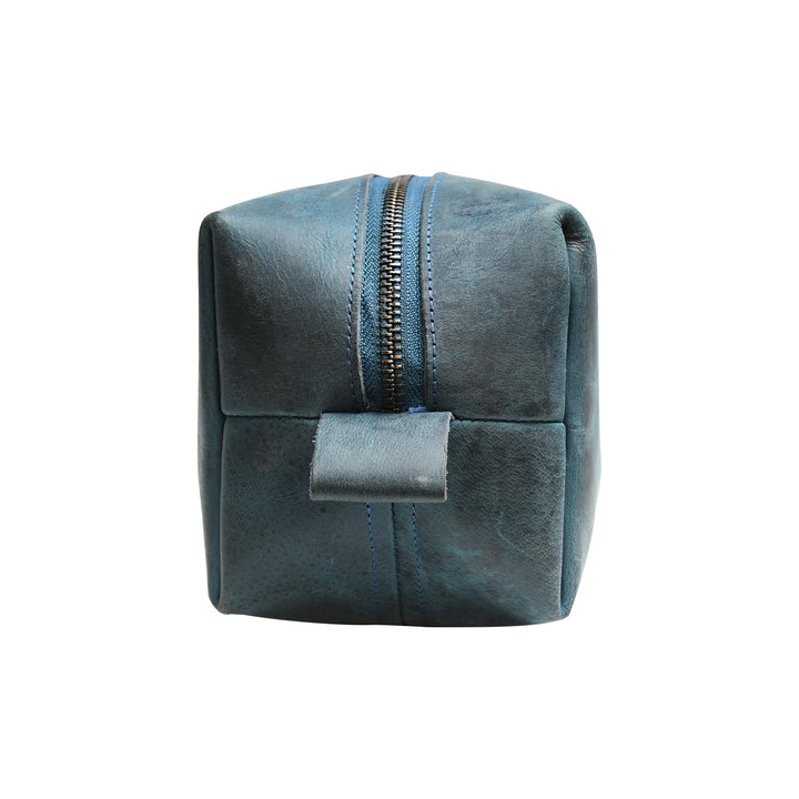 Blue suede pouch with a zipper on a white background