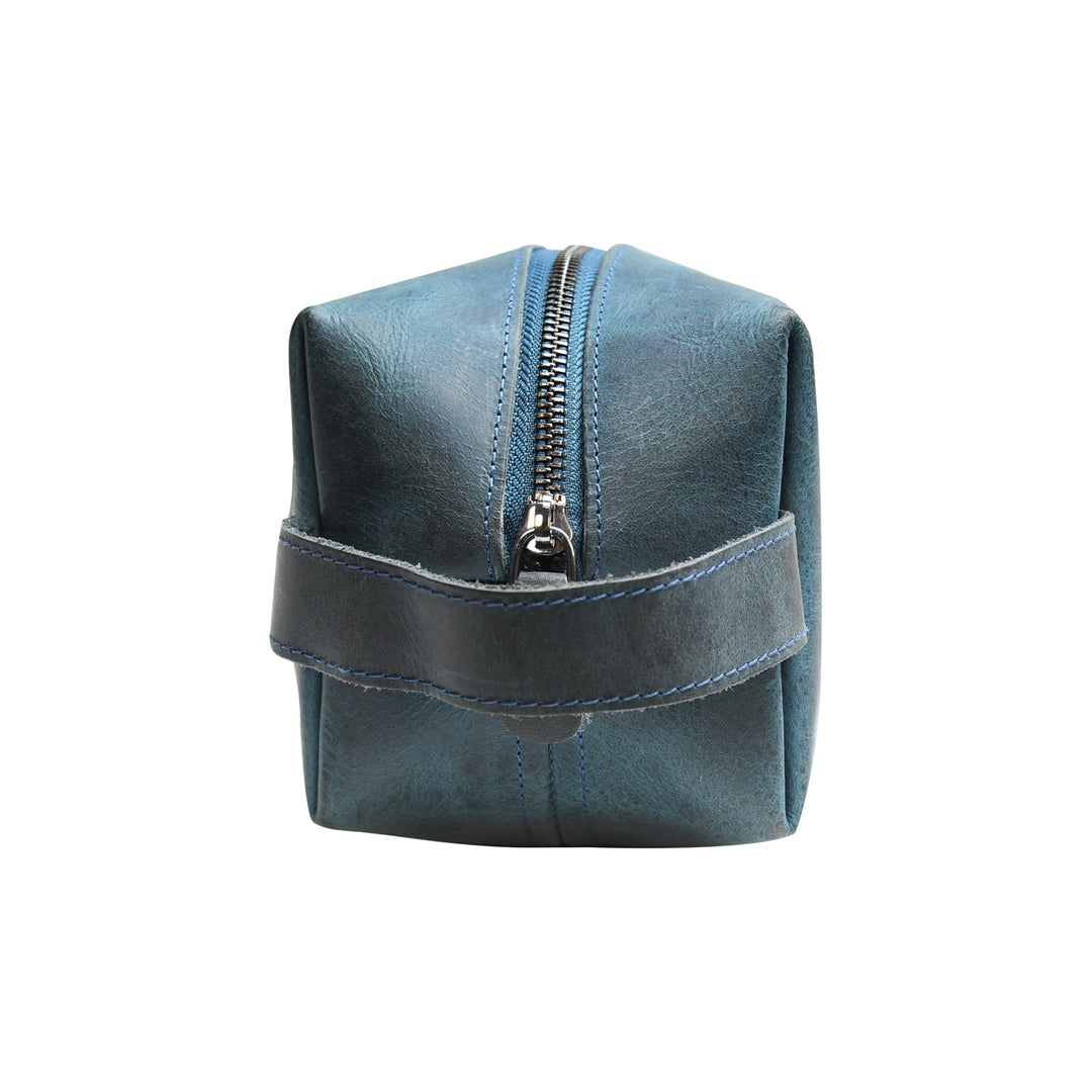 Blue leather pouch with a zipper on a white background