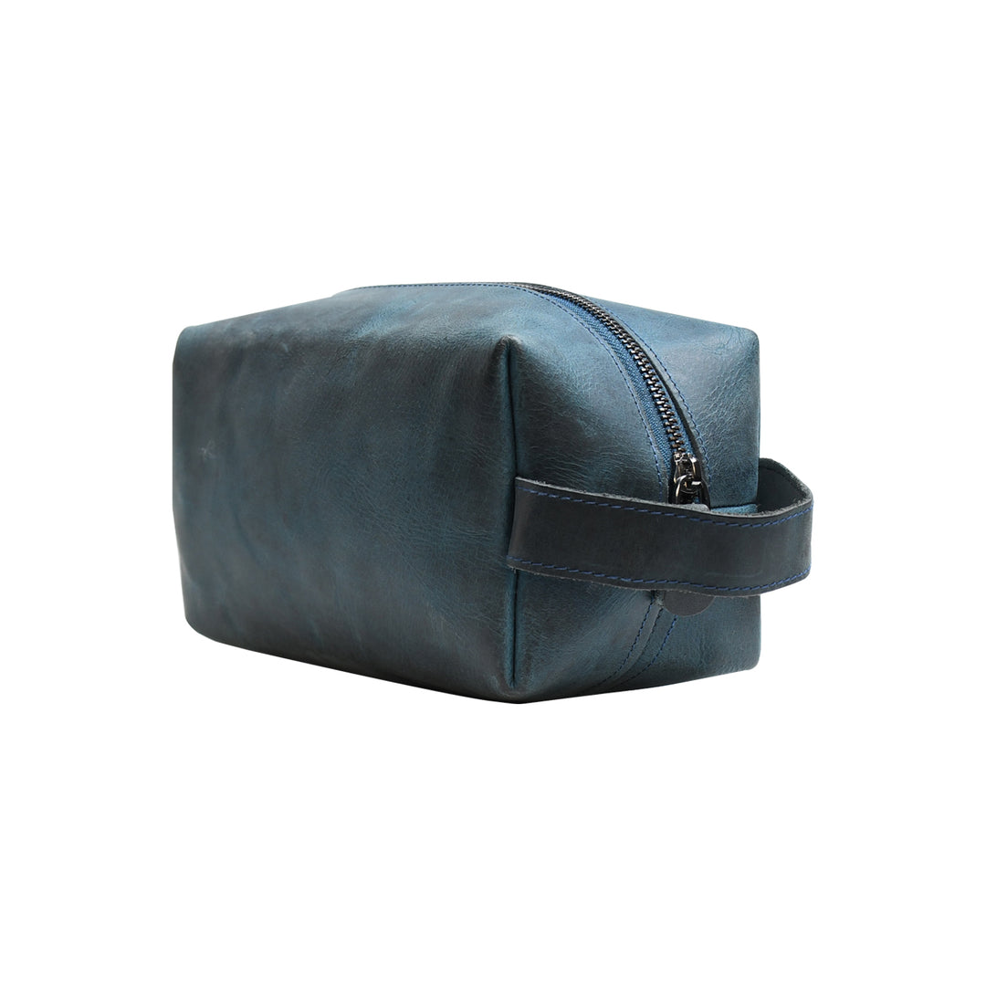 Blue toiletry bag with a handle on a white background