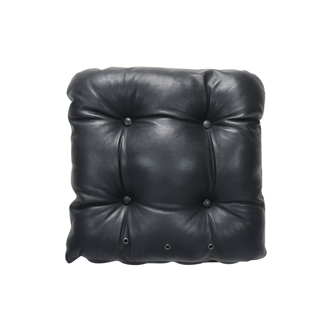 Black leather cushion with button tufting on a white background