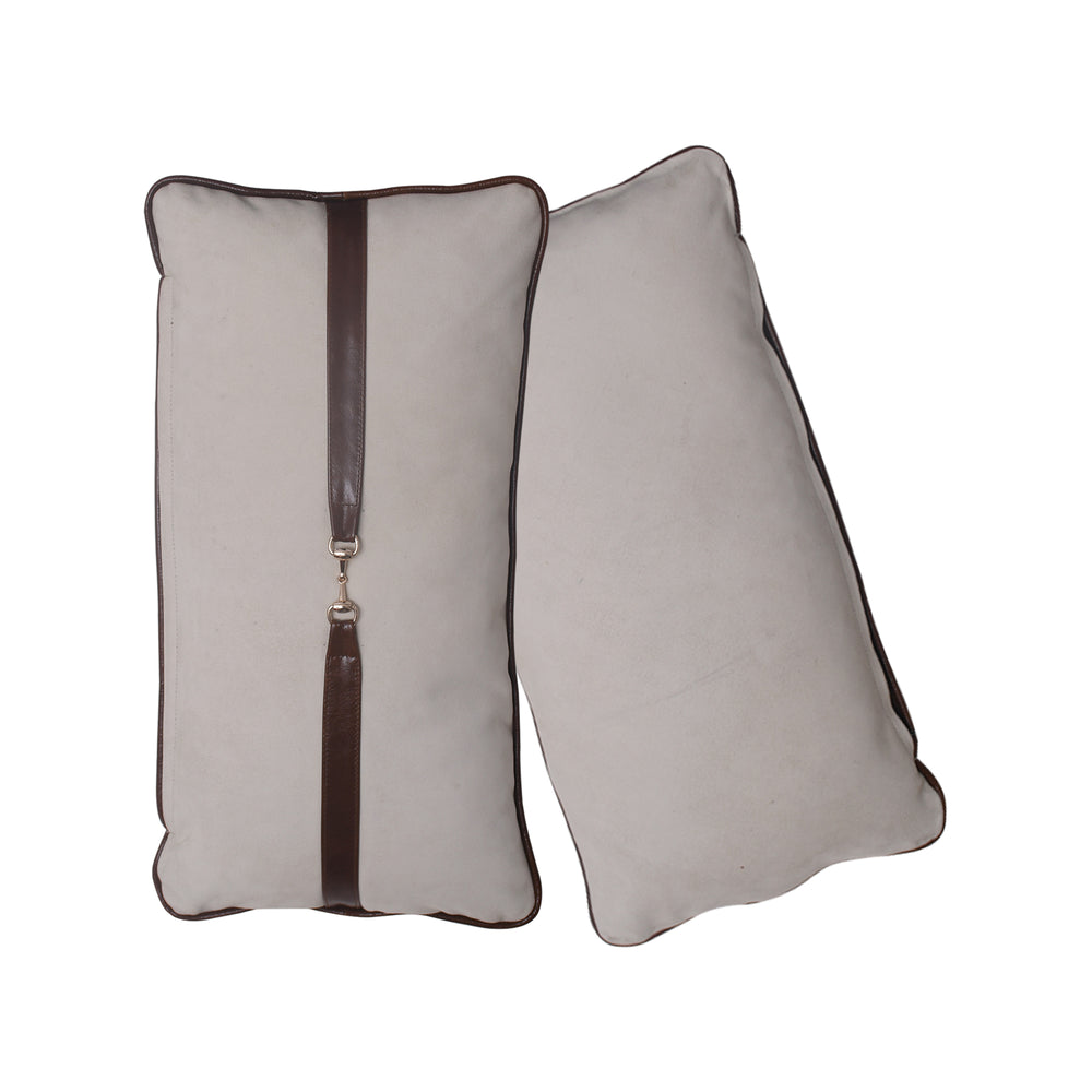 Two rectangular pillows with a brown zipper on a white background