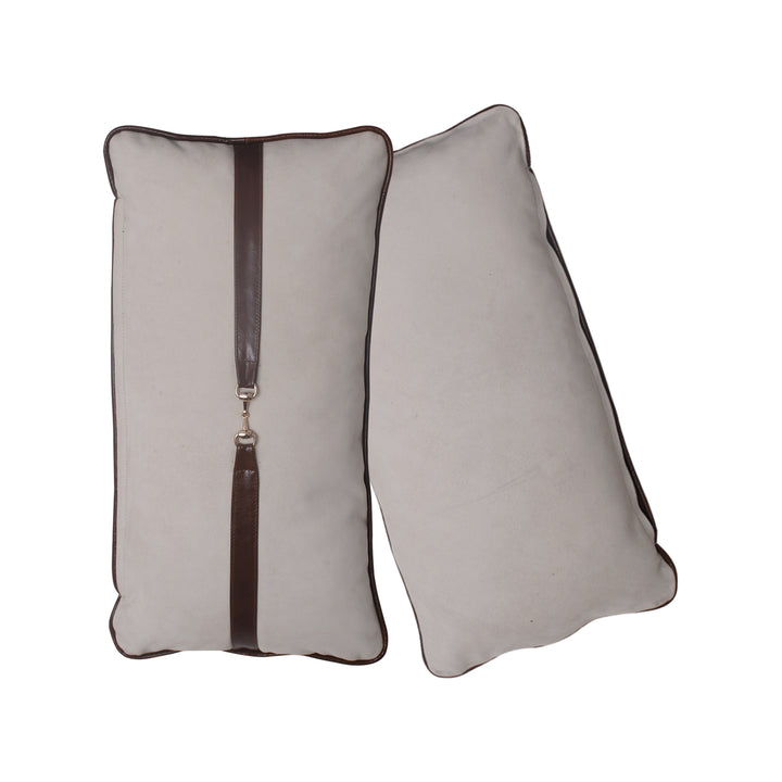 Two rectangular pillows with a brown zipper on a white background