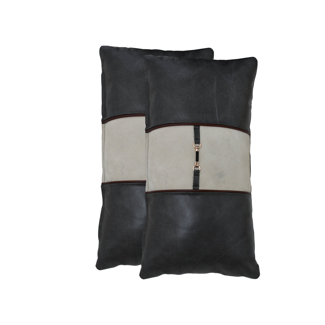 Two black and beige leather pillows with a zipper on a white background