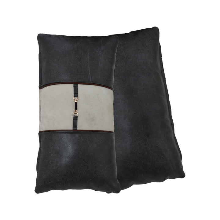 Black leather pillow with a central beige panel featuring a zipper on a white background