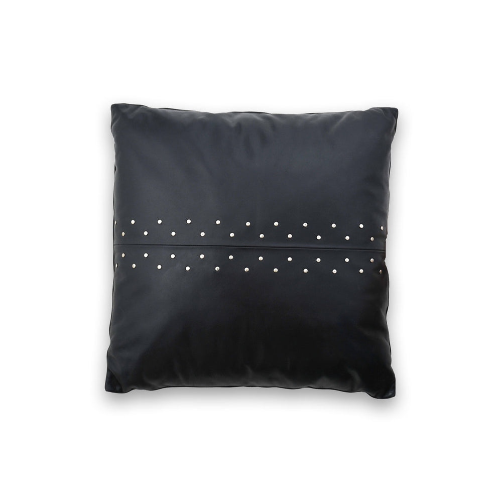 Black pillow with silver studs on a white background