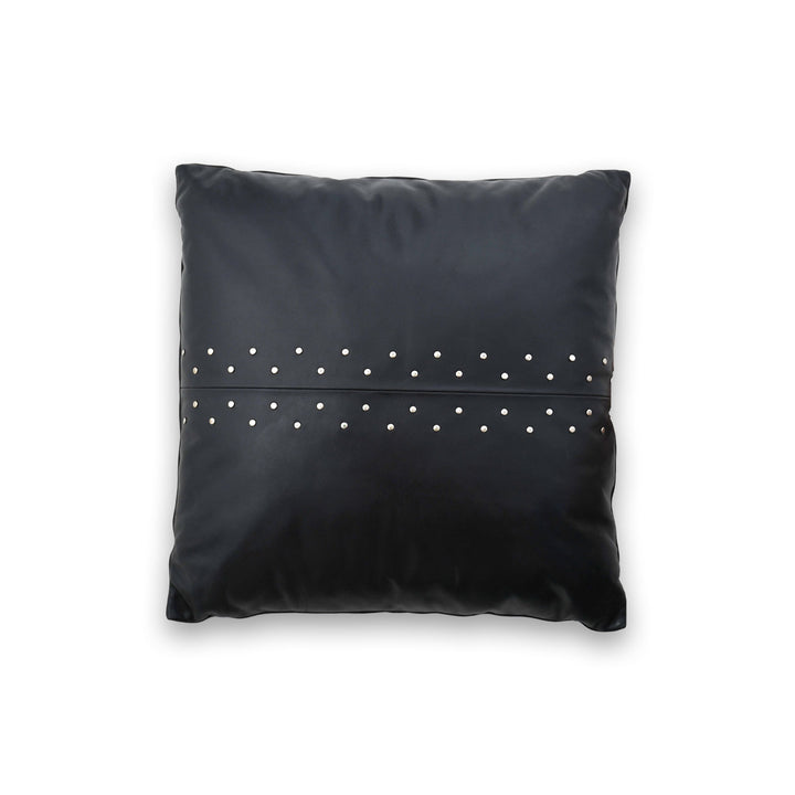 Black pillow with silver studs on a white background
