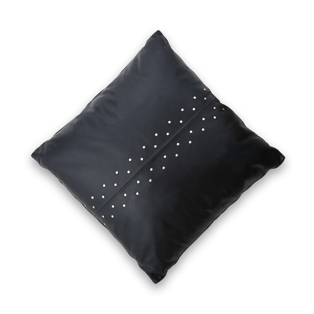 Black pillow with silver studs on a white background