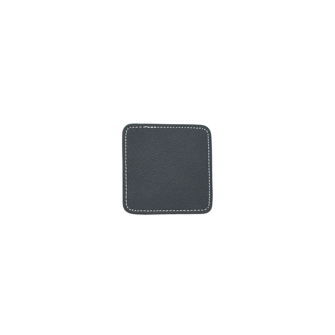 Black square coaster with white stitching on a white background