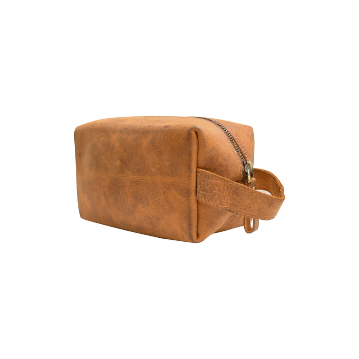 Brown leather toiletry bag with a strap on a white background