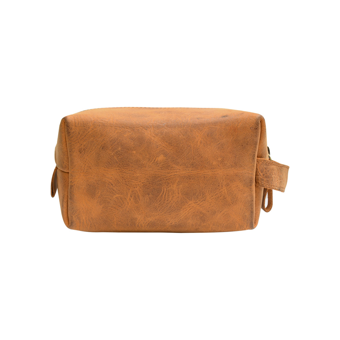 Brown leather toiletry bag on a white background