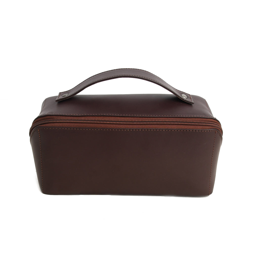 Brown leather toiletry bag with a handle on a white background
