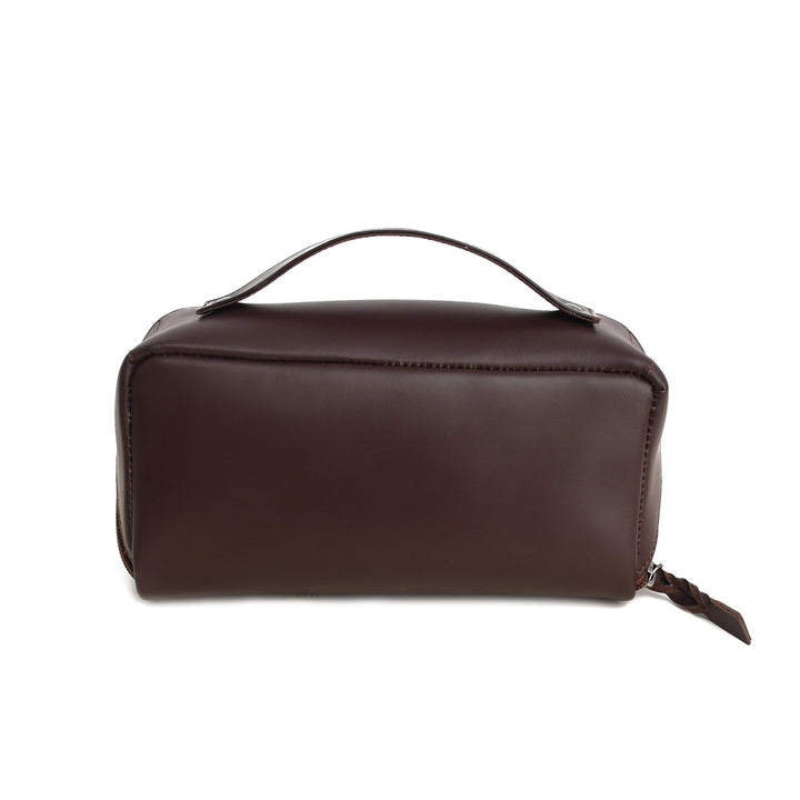 Brown leather toiletry bag on a white background