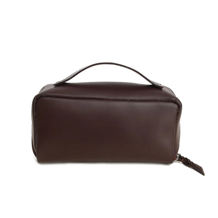 Brown leather toiletry bag on a white background