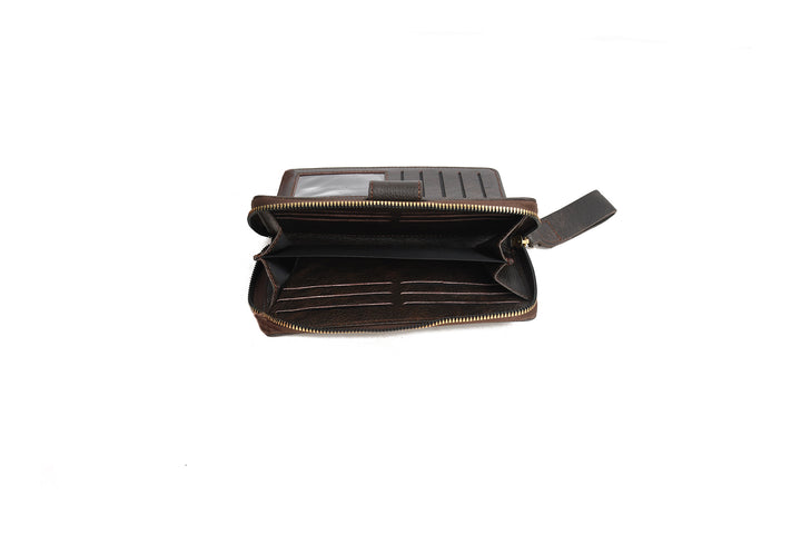 Open brown leather wallet on a white background