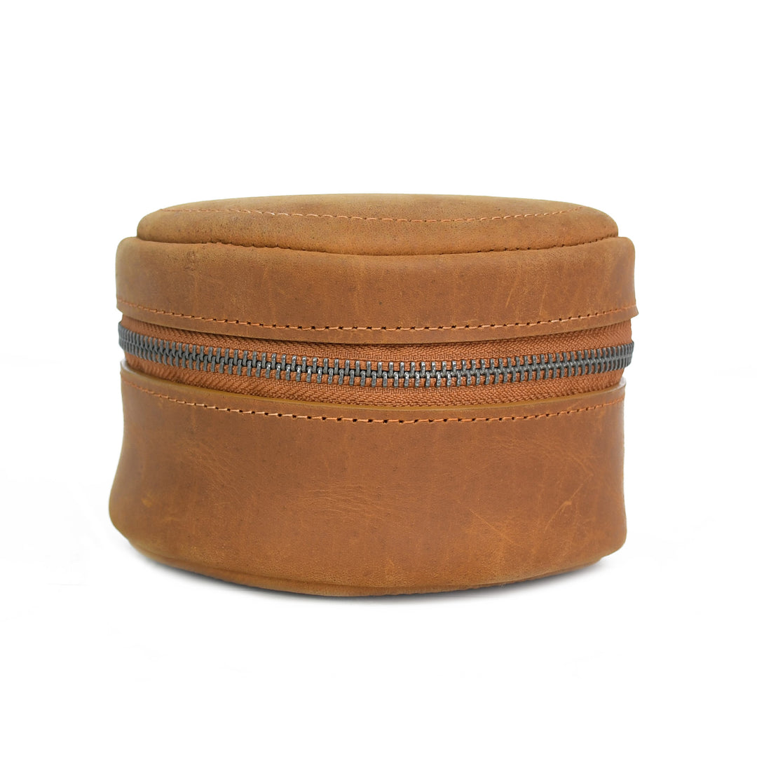 Brown leather jewelry box with a zipper on a white background