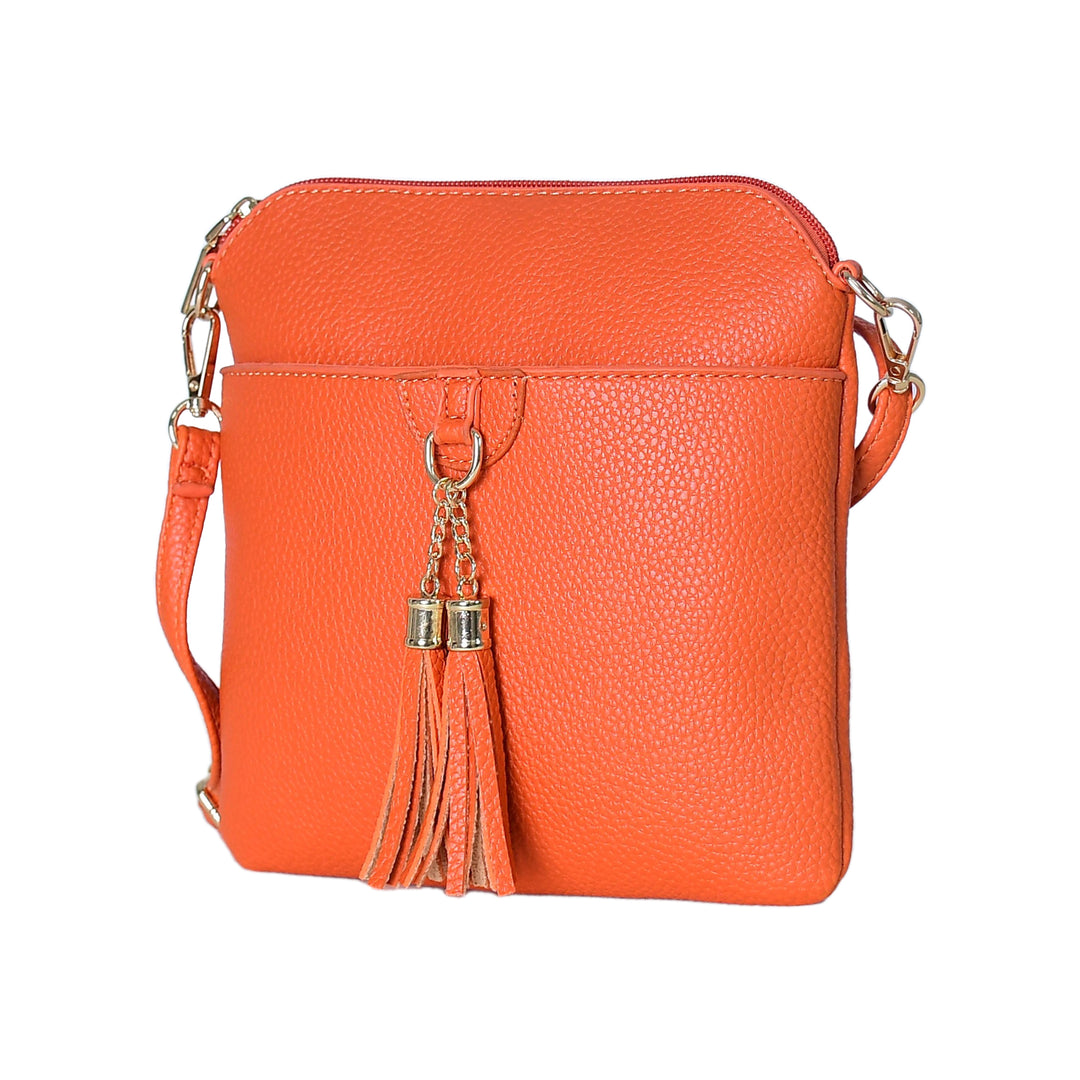 Orange crossbody bag with tassels on a white background